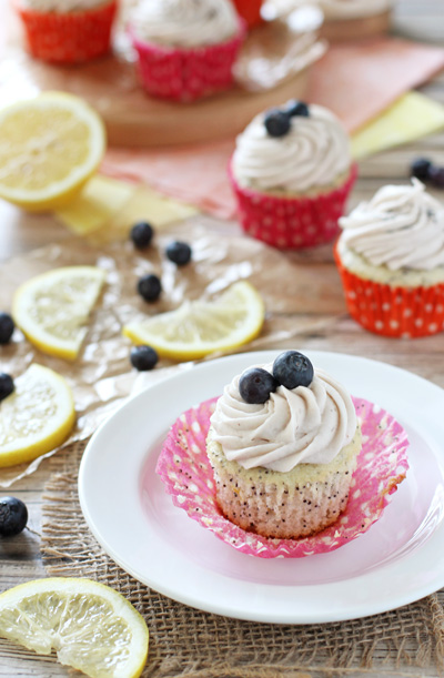 Lemon Poppy Seed Cupcakes with Blueberry Cream Cheese Frosting | cookiemonstercooking.com